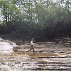 man walking on rocks