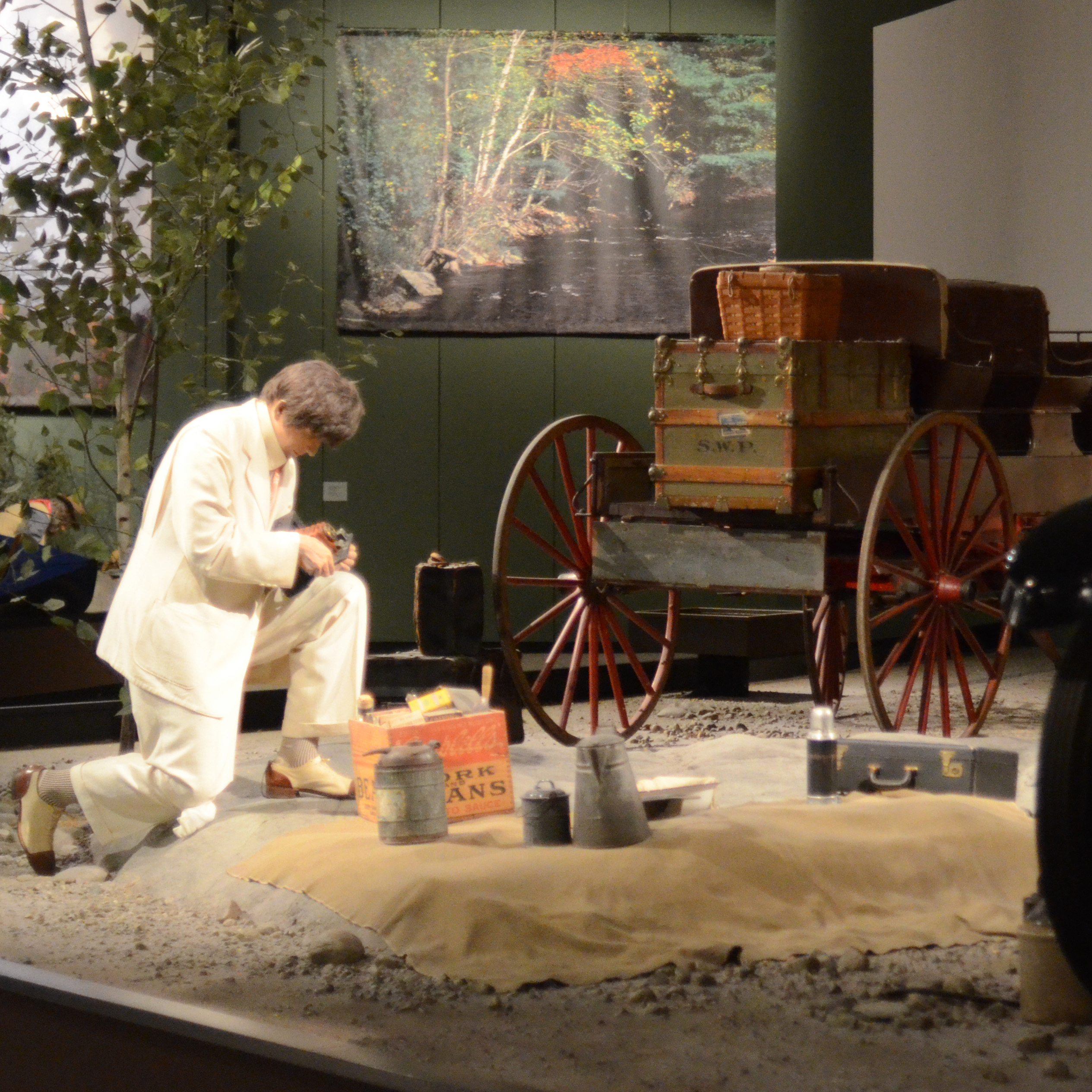 exhibition view of a historical tourist in an Adirondack scene